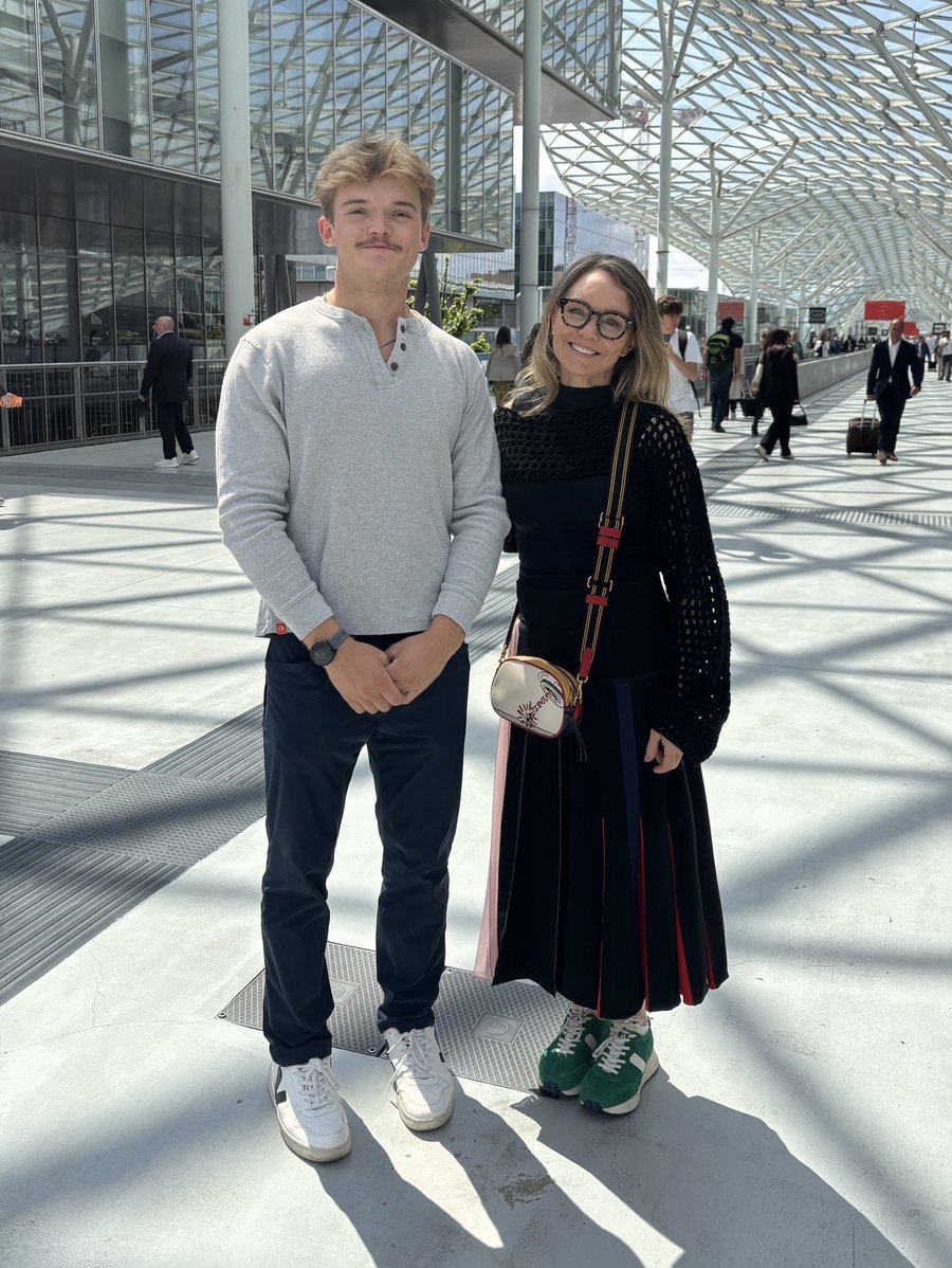 Grant and Tammy standing side by side under a glass roof